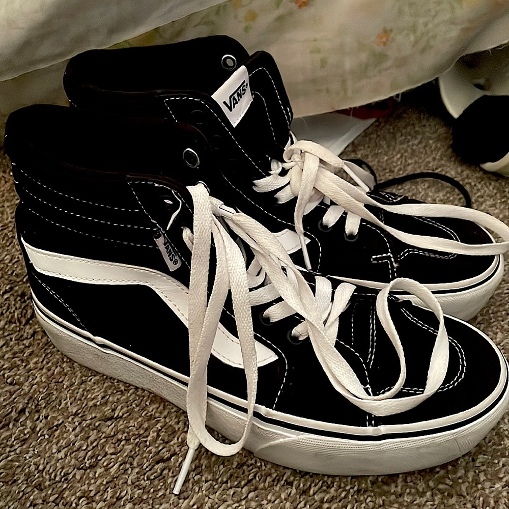 These are high top black/white vans that are size 7.